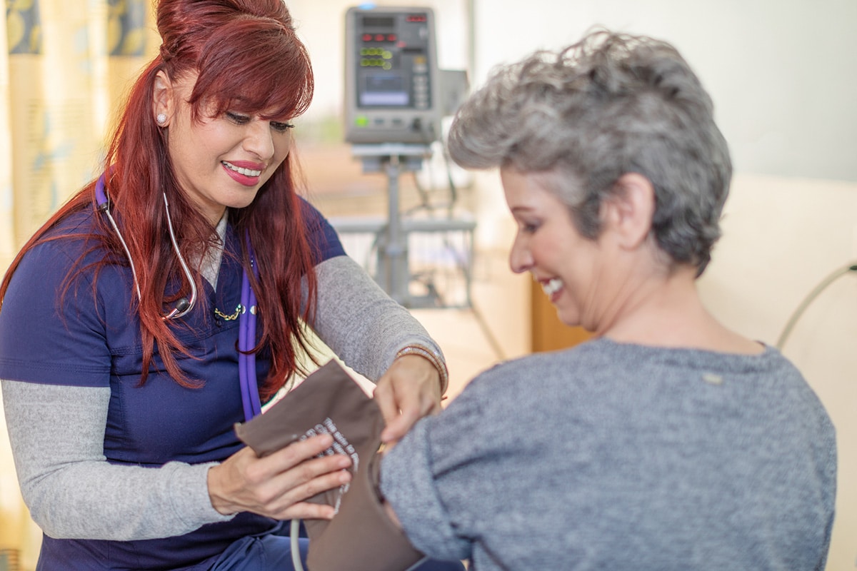 A nurse helping a resident at Stoney Point